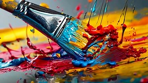 Download A paintbrush with colorful paint splashing out of it for free
