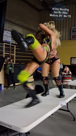 Fan In A Van on Instagram: "Dani Mo delivers the Moon Mist Twist on a table to Mika in this JCW vs. ASW Women's Championship title-for-title clash. ★★★★★★ Recently, In the Wrestling Annals ★★★★★★ All Star Wrestling 19th Anniversary goes insane Mar/22/2025 Civic Center Madison,WV ★★★★★★ Boone County Championship Bishop Baylor(c) v Nick Hamrick w/ A Vickers JCW American Championship Caleb Konley(c) v Smokey C Dalton Mckenzie/AJZ v Kirk Blackman/Ric Reeves Bruce Grey w/ Ron Mathis/Gary Damron v Mat