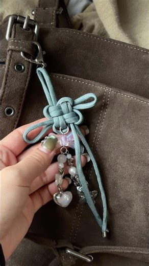 making lucky knot bag charms!