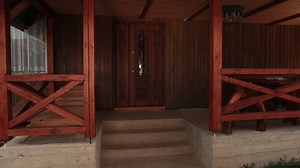 Rear view of a beautiful slim young brunette woman with suitcase leaves hotel room after long therapeutic vacation. Female goes on business trip leaving house, luggage, tourism, departure, fees travel