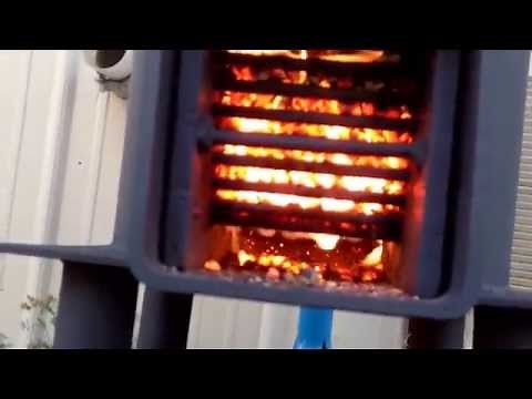 Rocket stove burning on pellets 15 hour burn time on three quarters of a bag wide open