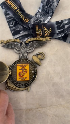 Super cool 50th anniversary medal opens to show the first patch given in 1976. | Joan Reimann