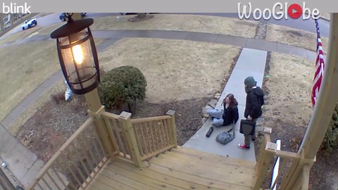 Girl slips and falls on black ice while heading out of home for school