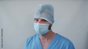 the masked doctor crying. pandemic has claimed many lives of people and doctors