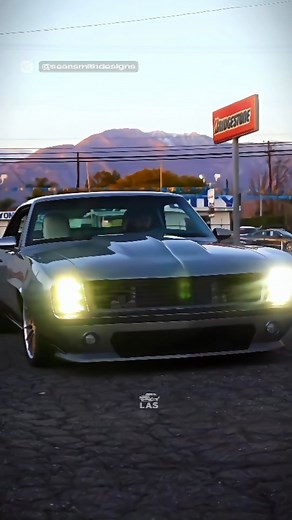 𝗟𝗔𝗦 on Instagram: "1200HP '69 Camaro: Time-Warping Silver Bullet Check out this insane '69 Camaro reborn as the Fenix. It's not just a car, it's a 1200-horsepower time machine that'll melt your face off. Legendary designer Sean Smith crafted this silver beast with champagne accents, packing a supercharged LS7 V8 that'll make your ears pop. It's part sculpture, part rocket ship, and 100% badass. #carstagram #musclecar #classiccar #restomod #carporn #camaro #chevrolet #v8power #supercharged #cu