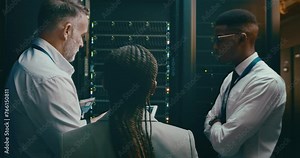 Team, tablet coding and server room for planning, digital screen programming or cloud computing solution. Manager, technician or group of people in data center for system or hardware problem solving