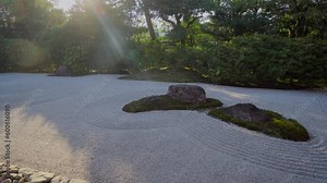 The design of the gardens in the Zen temples in Kyoto try to imitate the shapes of the sea, where the large stones are islands and the small ones are the sea and its waves.