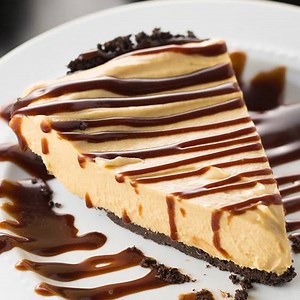Decadent PEANUT BUTTER FUDGE PIE with an Oreo cookie crust, and creamy peanut butter filling made with cool whip and cream cheese. Recipe: https://www.centercutcook.com/peanut-butter-fudge-pie/ | CenterCutCook