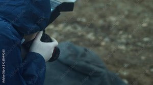 Forensic expert taking photos of dead body, high angle closeup