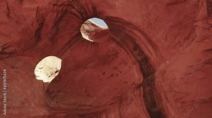 The beauty of cave eyes in the iconic Monument Valley, Utah. Explore the intricate natural rock formations of the cave as they blend seamlessly with the surrounding stunning desert landscape.