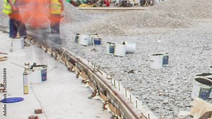 Workers install new tram rails on concrete plates during a reconstruction of the route timelapse. Filling by liquid resin for reduction of vibration and noice. Modernizations of tram tracks