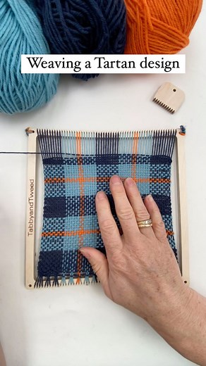 Weaving a Tartan design using a TabbyandTweed square frame weaving loom kit. We often sample weave before weaving a scarf or larger piece of fabric on a rigid heddle loom. Our weaving kits can be purchased from our TabbyandTweed website shop for UK delivery or our TabbyandTweed Etsy shop for delivery elsewhere. #Tartanweaving #weavingloom #tartan #woventextiles #weavingkit | TabbyandTweed
