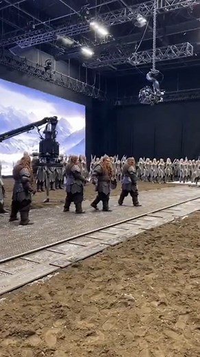 35K views · 222 reactions | The Hobbit — Armored Dwarves On Battlefield ⚔️️ Dwarf actors in full heavy armor stand against a stunning LED mountain backdrop, preparing for a battle scene as the crew positions cameras and extras in formation. The detailed costume work and epic scale of the set bring the world of Middle-earth to life right inside the studio. #TheHobbit #BTS #Dwarves #MiddleEarth #FantasyFilm #BehindTheScenes #FilmProduction #EpicSet | Studio Breakdown | Facebook