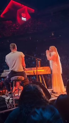 Chris Martin of Coldplay & Elyanna perform "We Pray" at #iHeartFestival2024 | Billboard
