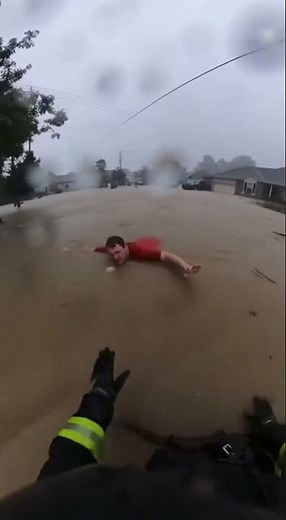 Firefighter Saves Life in Raging Floodwaters