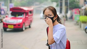 The girl wore a black nose costume N95 to protect against PM 2.5 dust, which is highly valued in traffic cities. And the anti-virus Covid-19 That is pandemic all over the world