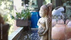 Common fountain sculpture of the Thai ancient woman in the pond