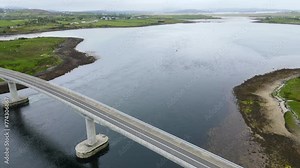 A drone shot of a bridge crossing a bay along the Atlantic Ocean. Harry Blayney Bridge, Mulroy, Co. Donegal, Ireland