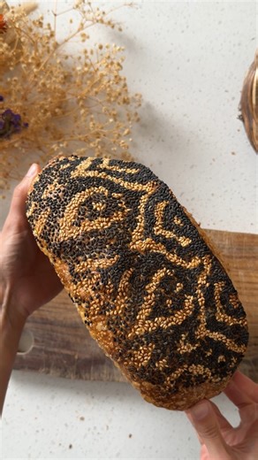 Take your sourdough to the next level with this stunning black and white sesame seed design by Rachel (@sourdough_enzo). 🍞 Arrange your pattern right on the counter, then gently press your dough into it before transferring to a banneton. After an overnight rest, a simple expansion score will reveal the eye-catching design baked right in. Try it out — it takes a bit of patience, but the results are always worth it! Produced in association with CBC Creator Network. #Sourdough #sourdoughlove #scor
