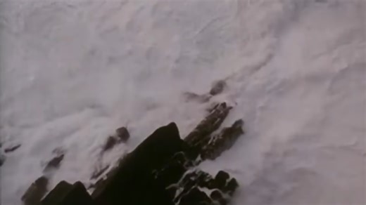 Watch 30-foot waves smash this lighthouse - then an explosion hits