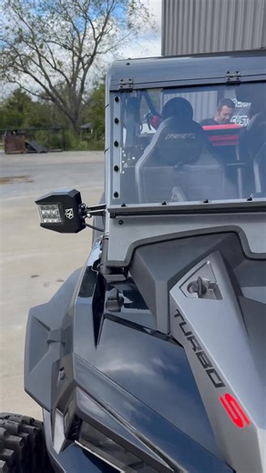 5.5K views · 79 reactions | Check out this new flip-up windshield setup we are now offering with our cage builds! Open/close on the fly with electric rams, and you can drive 75mph with it wide open. This is Tommy Little’s concept on his newest cage from us, and we figured it was time to build some more of them! 﫡 | Blue Fire Motorsports | Facebook