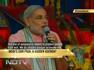Narendra Modi prays to machine guns