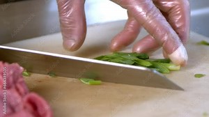 Chef chopping spring onions in traditional Chinese kitchen. Stock Video