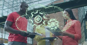 Animation of cloud with cog wheels over diverse colleagues discussing work in office