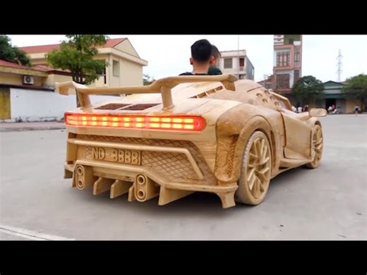 Test drive a homemade wooden Bugatti on the street with my son