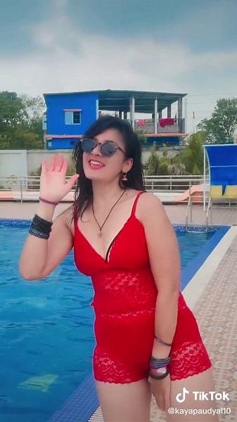 Playful Moments by the Pool in a Lace Swimsuit