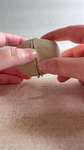 Ycceramics on Instagram: "Still hanging around in my shop… and clearly not planning on flying anywhere 🕊️🪦 This is the latest version of my pinch-pot pigeon, reworked with a shorter, sleeker tail, a shimmering iridescent crown, and those X ed out eyes finished in real gold. A little New Year’s glam for the afterlife just felt appropriate. What do you think did I nail the sparkle, or is he perfectly, unapologetically over the top? 🥂#ceramicart #whimsicalart #handmadeceramics #potteryartist #od