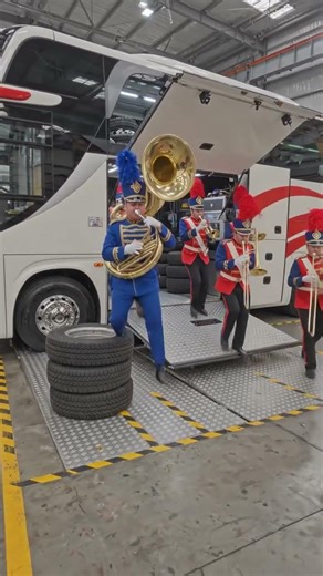 A Marching Band Parades Past The Bus Honking