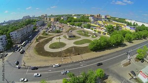 City traffic on square with tramway and metro station at spring