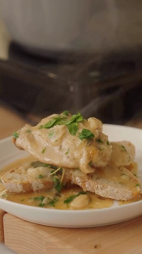 Chef Emeril J. Lagasse III on Instagram: "Chicken with 40 Cloves of Garlic. The ultimate comfort dish. Enjoy! 🧄🧄🧄 2 tablespoons olive oil 6 to 8 bone-in chicken thighs (enough to fit in your Dutch oven in one layer) Kosher salt and freshly ground black pepper Emeril’s Original Essence, to taste, or other Creole seasoning 2 tablespoons unsalted butter, at room temperature 2 tablespoons all-purpose flour 6 sprigs fresh thyme 40 cloves garlic, peeled (3 whole heads) 1/4 cup fresh lemon juice, or