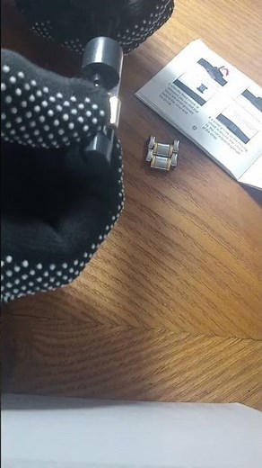 Removing unwanted links on band for a firmer fit - OLEVS WATCH