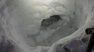 Missing teen snowmobiler builds snow cave to survive
