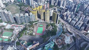 Railway Superstructure Property development Construction Project built on a hillside slope peak in Ho Man Tin Hung Hom To Kwa Wan, aerial skyview of the skyline of Hong Kong Victoria Harbour Financial