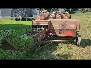 Amish Farmer Baling Alfalfa