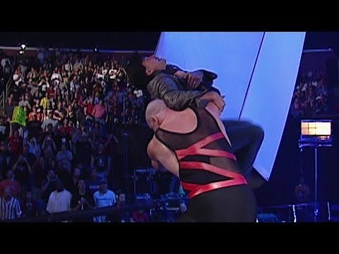 Kane chokeslams Eric Bischoff off the stage
