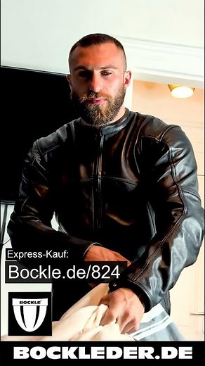 Muscular man in a Bockle leather suit and leather jeans. Lederhosen Bockleder.de