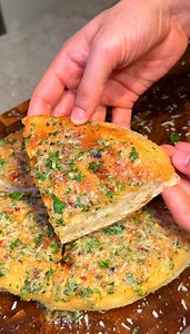 1.6M views · 12K reactions | Pan-Fried Garlic Focaccia 龍䀘�No oven. No kneading. Just pure comfort. What you’ll need:� Soft focaccia dough�㮝 Olive oil�龍 Garlic confit�杻 Vegan butter�燎 Vegan parmesan� Fresh parsley Cook it low and slow in a pan until golden and airy, then finish with that rich garlic butter on top. Crispy outside, fluffy inside, and way too easy not to make again ‍ | Dr. Vegan | Facebook
