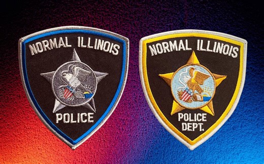 An Illinois police department shows off new patches as it modernizes its uniforms