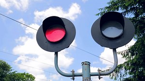 Traffic light flashing red lights. Railway traffic light that prohibits the movement of cars. Traffic light on the railway.