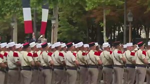 Macron reviews troops and watches military parade as France celebrates Bastille Day