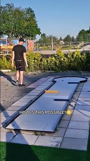 Person does an impressive mini golf trick shot!