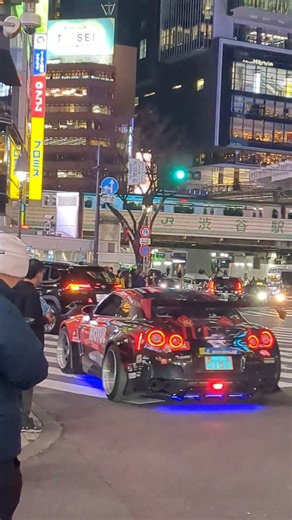 A gorgeous smart car passing through Shibuya. Tokyo, Japan.