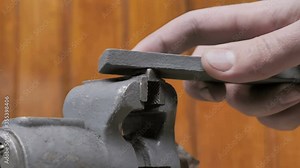 Worker Hand File A Piece Of Metal In A Factory