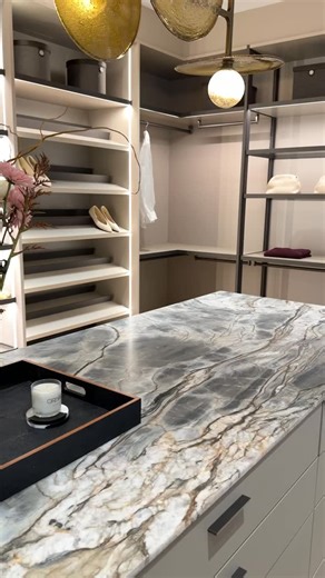 ARMINA STONE on Instagram: "A custom walk-in closet designed with Blue Tempest Quartzite, combining natural stone with clean, refined design. Blue Tempest Quartzite is featured on the island surface, creating a subtle yet striking focal point. An integrated sink is incorporated into the space, adding seamless functionality and a polished, elegant touch. We’re excited to share more visuals from this project. Photos and videos highlighting the details will be coming soon."