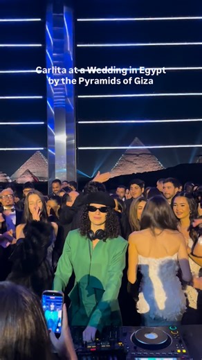 Cairo Spots on Instagram: "Carlita on the decks, the Pyramids of Giza in the background, and a private wedding crowd in full celebration mode. A rare setting for an intimate night, where electronic music met one of the world’s most iconic landmarks. Moments like these continue to place Egypt at the center of unforgettable, invite only experiences that blend music, history, and atmosphere in a way few places can. Follow @cairospots, visit our website cairospots.com and download our Cairo Spots iO