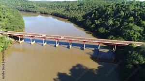 Drone revealing an impressive bridge within the Amazon rainforest.